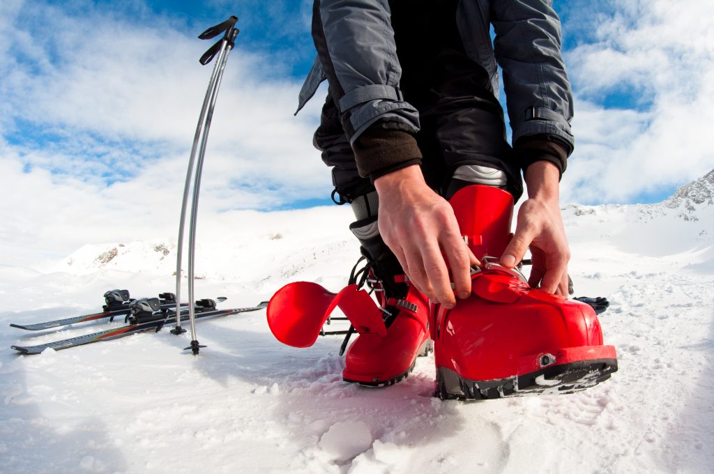Man Fastening Ski Boots